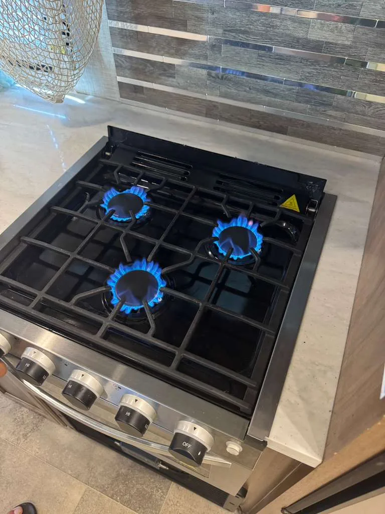 RV appliance repair and installation in a motorhome kitchen