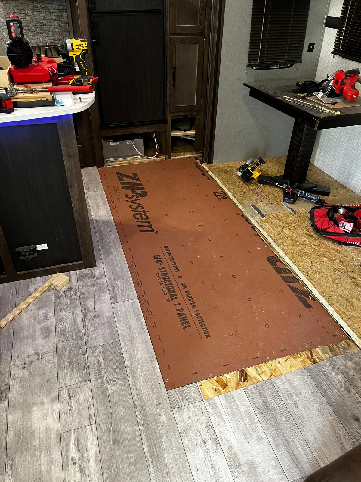 Heritage RV technician fixing the floor after a water leak inside an RV
